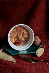 Croissant with ham, cheese in mini cup on red background. Selective focus. Tasty breakfast sandwich or snack