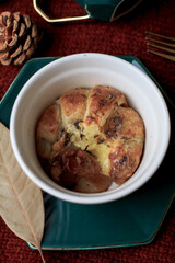 Croissant with ham, cheese in mini cup on red background. Selective focus. Tasty breakfast sandwich or snack