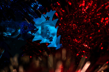 Closeup shot of red and blue Christmas tinsel garland