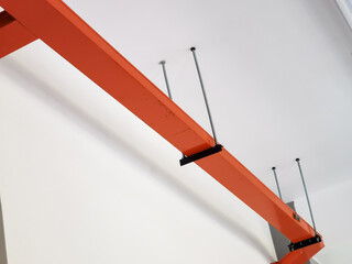Over head orange color cable tray or trunking mount on concrete ceiling.