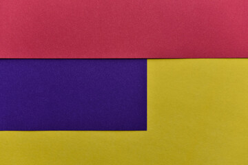 abstract geometric paper background. violet, yellow and red trendy colors. The backdrop for an...