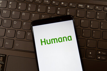Fototapeta premium Toronto, On, Canada - December 19, 2021: Humana logo on smartphone screen on a keyboard.Humana Inc. is a for-profit American health insurance company.