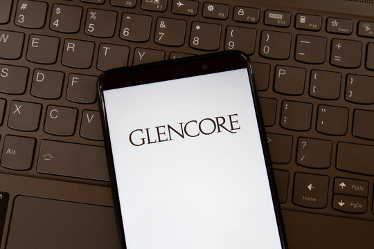 Toronto, On, Canada - December 19, 2021:  Glencore  logo on smartphone screen on a keyboard. Glencore plc is an Anglo-Swiss multinational commodity trading and mining company.