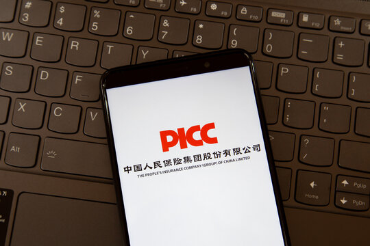 Toronto, ON, Canada - December 19, 2021: PICC (The People's Insurance Company of China Limited) logo on the smartphone screen on a keyboard. PICC is a Chinese listed insurer. 