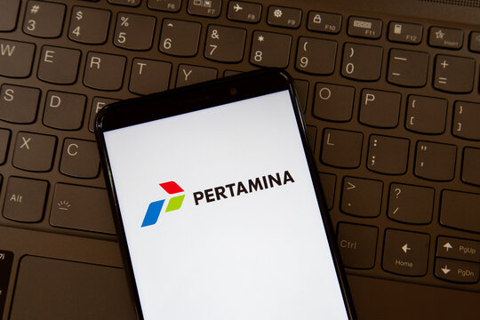 
Toronto, On, Canada - December 19, 2021: Pertamina logo on smartphone screen on keyboard. PT Pertamina is an Indonesian state-owned oil and natural gas corporation. 
