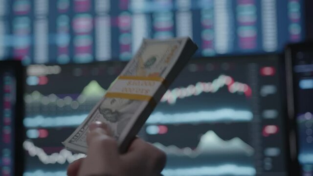Ten thousand dolar bill on  cryptocurrency stock chart analysis monitors background, crypto money concept