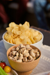 bowl of pistachios and chips