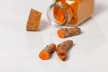 Fresh organic root and turmeric powder - Curcuma longa