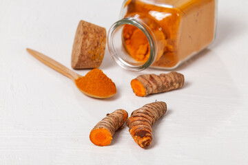 Fresh organic root and turmeric powder - Curcuma longa