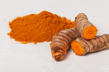 Fresh organic root and turmeric powder - Curcuma longa