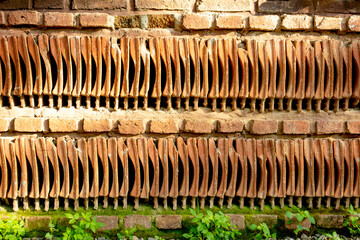 wall made from terracota, bricks and roof.