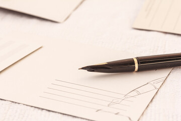 Blank postcards and a pen, fountain pen on white background. Copy space