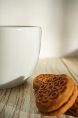 Coffee and cookies in wooden table 