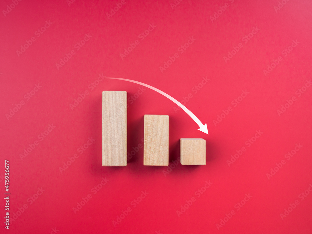 Aufkleber graph trending downwards. business crisis concept. down arrow on three wooden blocks chart steps on 