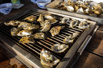 Close up shot of grilling oyster © Kit Leong