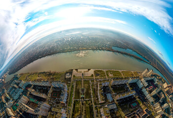 aerial drone 180 degrees panorama view of the Kuban River and Rozhdestvenskaya embankment of the city of Krasnodar (South Russia, Platanovy Boulevard) on a winter sunny day in mid-December