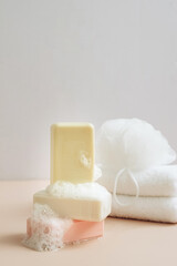 Natural organic handmade soap with large bubbles foam washcloth pastel background. Concept of using natural products 