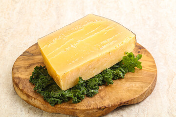 Parmesan cheese piece over board
