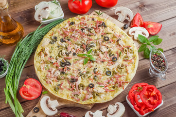 Delicious fresh homemade pizza with ham on wooden background with selective focus