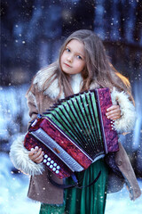 girl with accordion. beautiful winter girl playing the accordion - obrazy, fototapety, plakaty