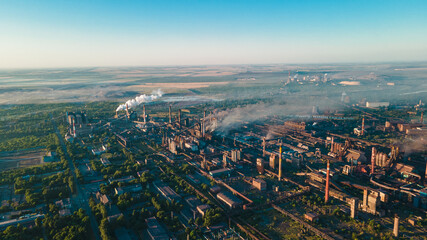 Fototapeta na wymiar factory smoke from chimneys from a height panorama