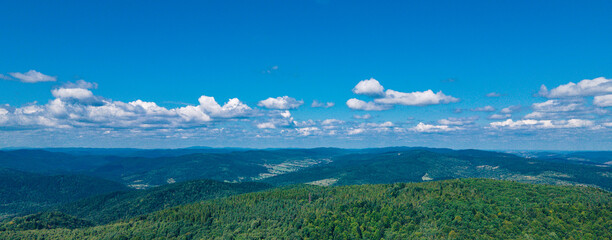 mountains aerial view in blue sky clouds