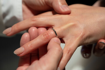 The moment of exchanging rings at a wedding