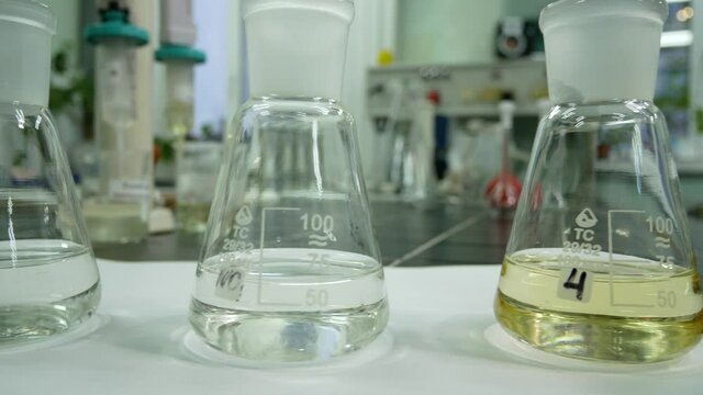 Flasks with reagents in the laboratory. Chemical experiments, research of substances for pharmacology