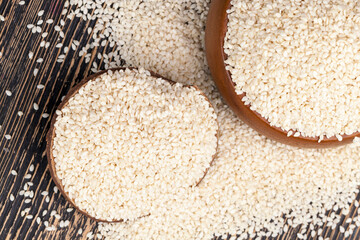 white sesame seeds on a wooden table