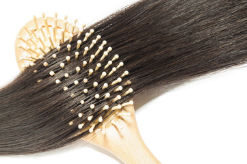 tape in adhesive virgin remy straight black human hair extensions with a wooden hairbrush