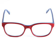 Red glasses frames on white background. Sun goggles and glasses for vision in red frames.