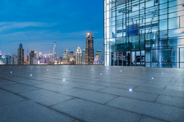 Fototapeta na wymiar Panoramic skyline and modern commercial office buildings with empty square in Shanghai at night