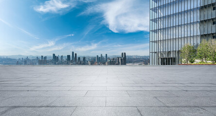 Fototapeta premium Empty floor with modern city skyline and buildings