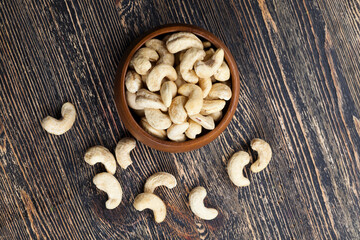 dried cashew nuts on a wooden table