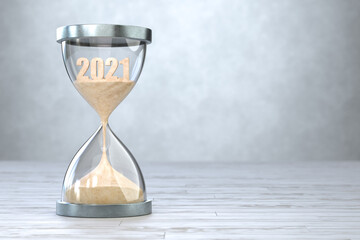 New Year 2022, The time of 2021 is running out in the hourglass.