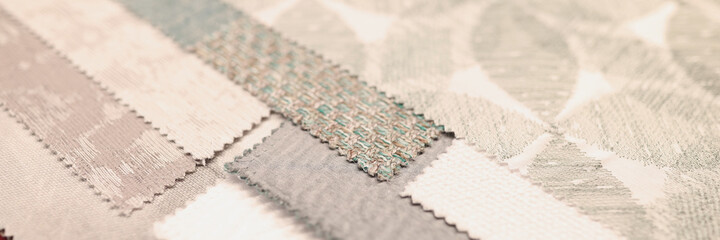 Closeup of samples of upholstery fabrics in store