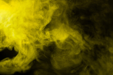 Yellow steam on a black background.