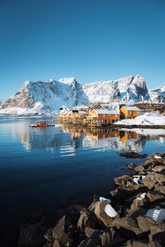 Lofoten winter scenery with traditional fisherman Rorbuer cabins, Sakrisoy, village of Reine, Norway