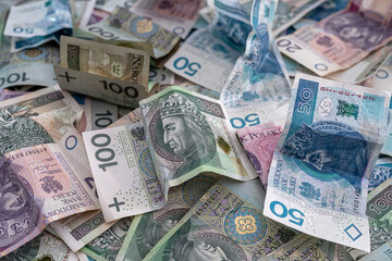 Obraz na płótnie Canvas pile of polish banknotes zloty as financial background