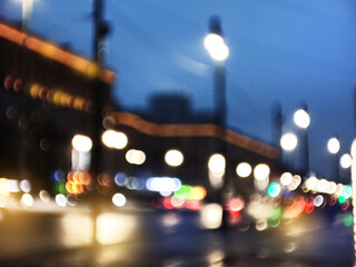 Abstract blurred defocused night city background with traffic lights bokeh