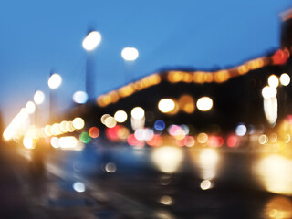 Fototapeta na wymiar Abstract blurred defocused night city background with traffic lights bokeh