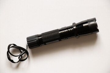 stun gun flashlight to scare off dogs on an isolated background, protection from dogs, schoker
