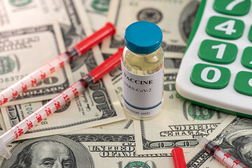 the new high-quality vaccine they brought is next to a calculator and dollar bills.