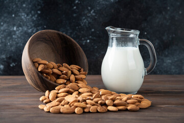 Milk with almonds in wood bowl