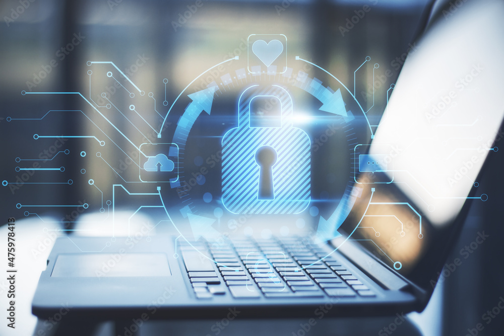 Poster close up of notebook on desktop with abstract glowing blue padlock hologram on blurry background. in