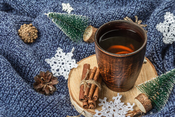 Obraz na płótnie Canvas Black tea in ceramic cup with traditional New Year decoration