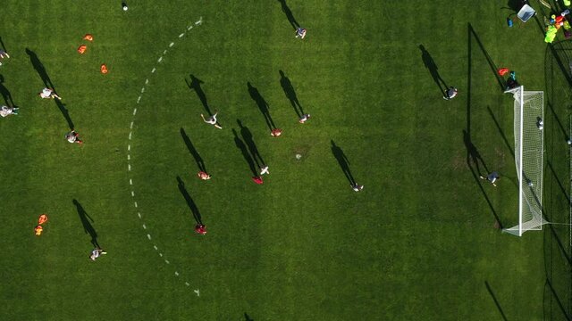 Top view of a sports football field with players playing football.a small football field on the street in the city.Belarus