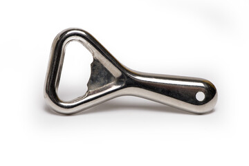Closeup retro metal bottle opener white background
