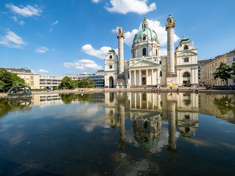 Austria, Vienna, Karlskirche reflecting in reflecting pool