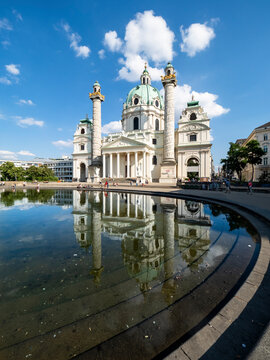 Austria, Vienna, Karlskirche reflecting in reflecting pool